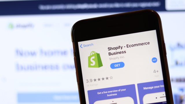 Why is Shopify moving its listing from NYSE to NASDAQ important for investors?